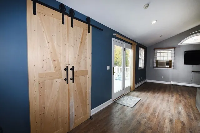 a room with gym equipment and a large window