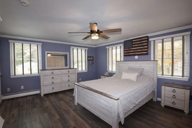 a living room with furniture pool table and window
