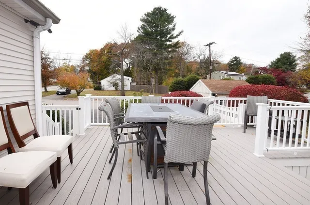 a kitchen with white cabinets and appliances