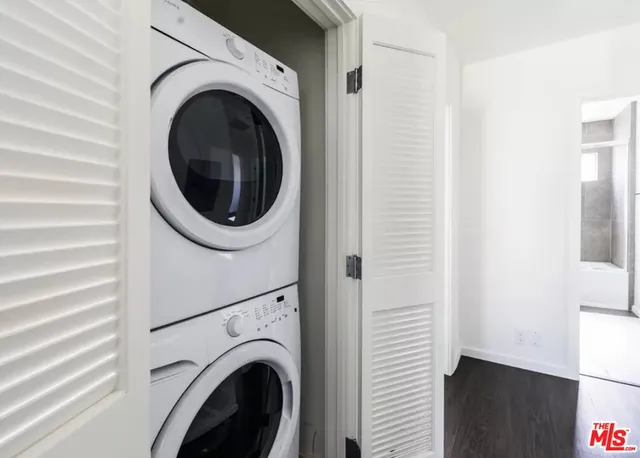 a view of a hallway with washer and dryer