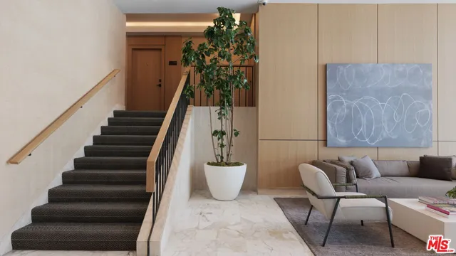 a view of hallway with wooden floor