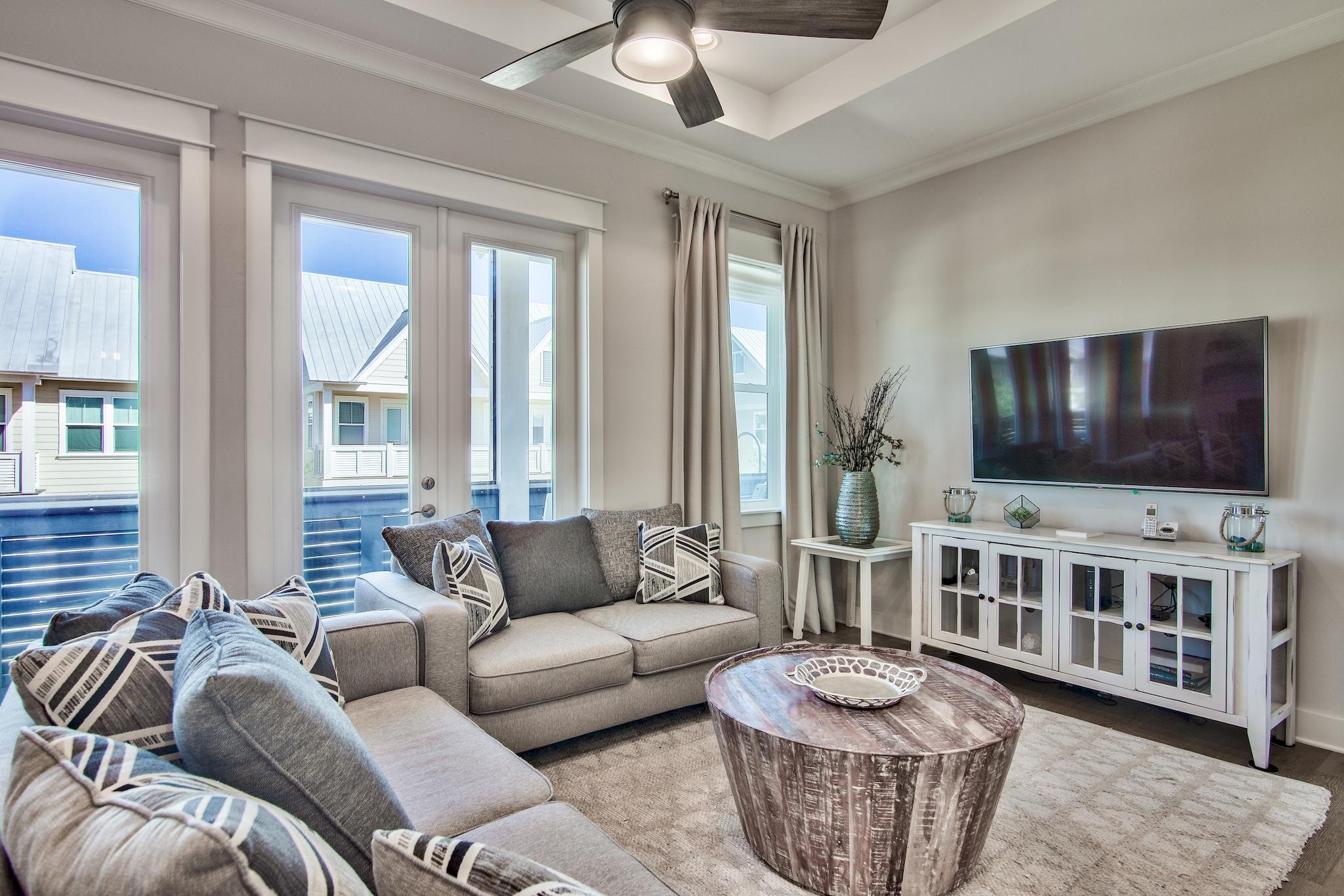 33 Milestone Dr Inlet Beach, Unit C Inlet Beach, FL 32461 - Photo 1 of 24 a living room with furniture and a flat screen tv