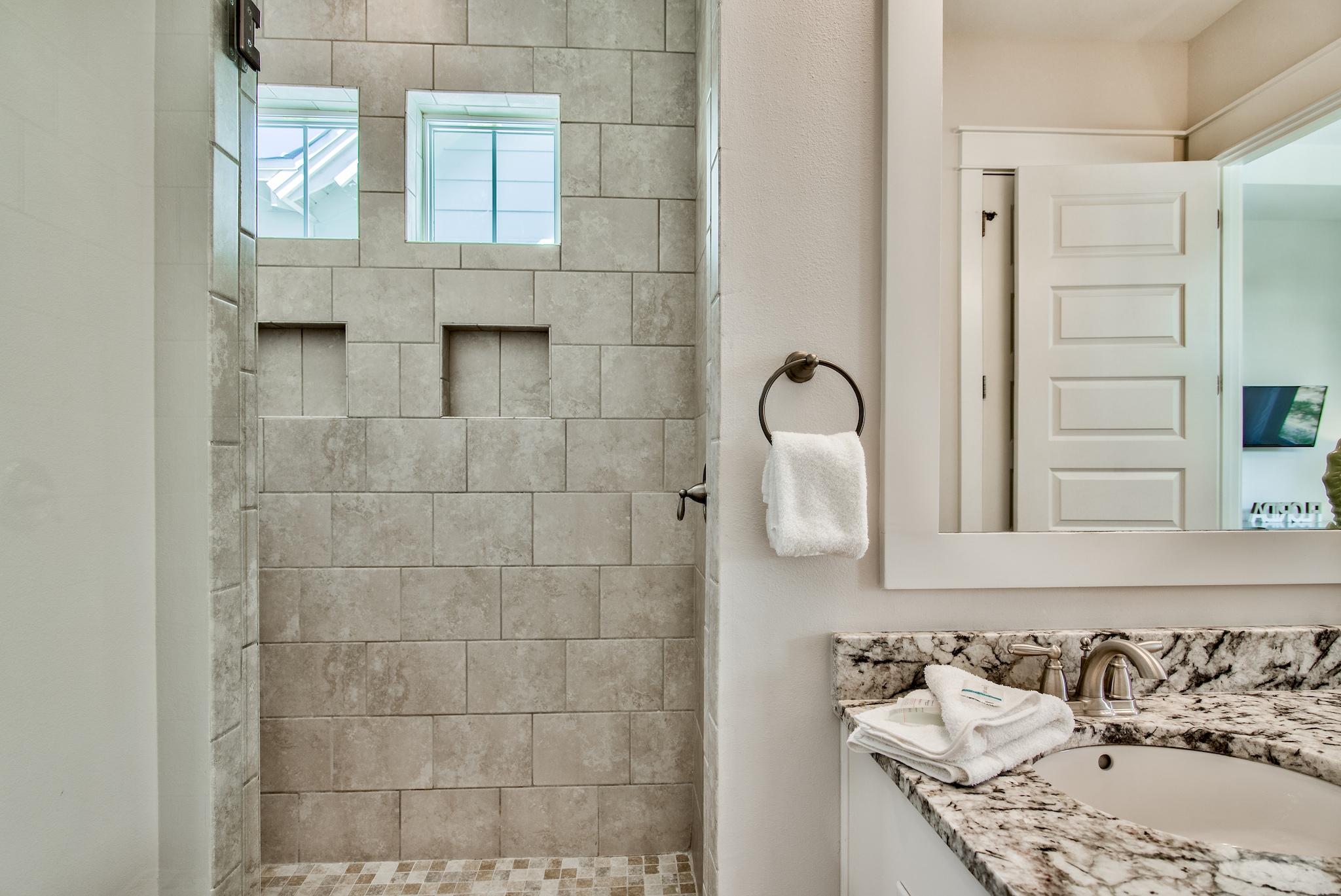 33 Milestone Dr Inlet Beach, Unit C Inlet Beach, FL 32461 - Photo 14 of 24 a bathroom with a sink and a mirror