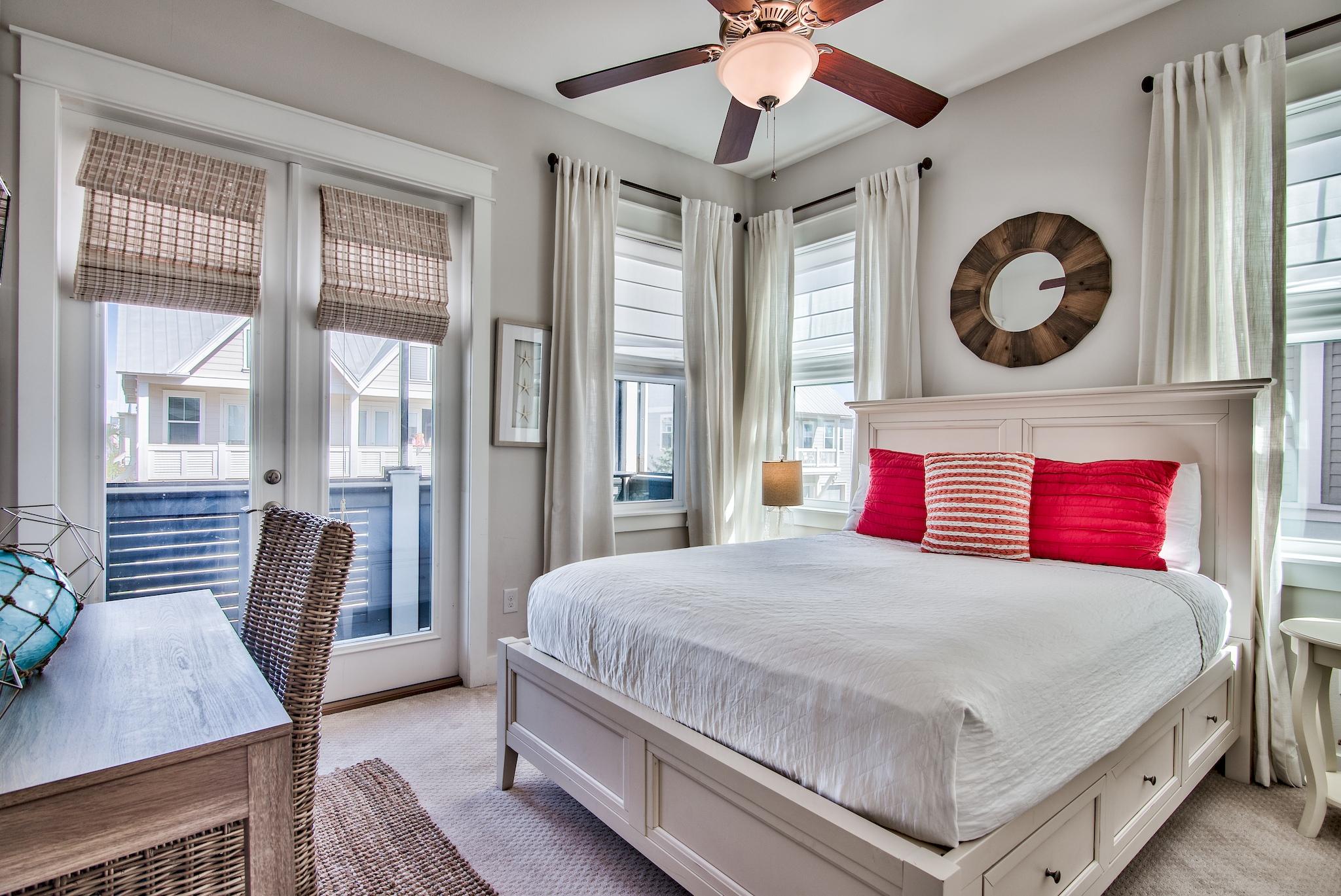33 Milestone Dr Inlet Beach, Unit C Inlet Beach, FL 32461 - Photo 15 of 24 a bedroom with a large bed and a chandelier