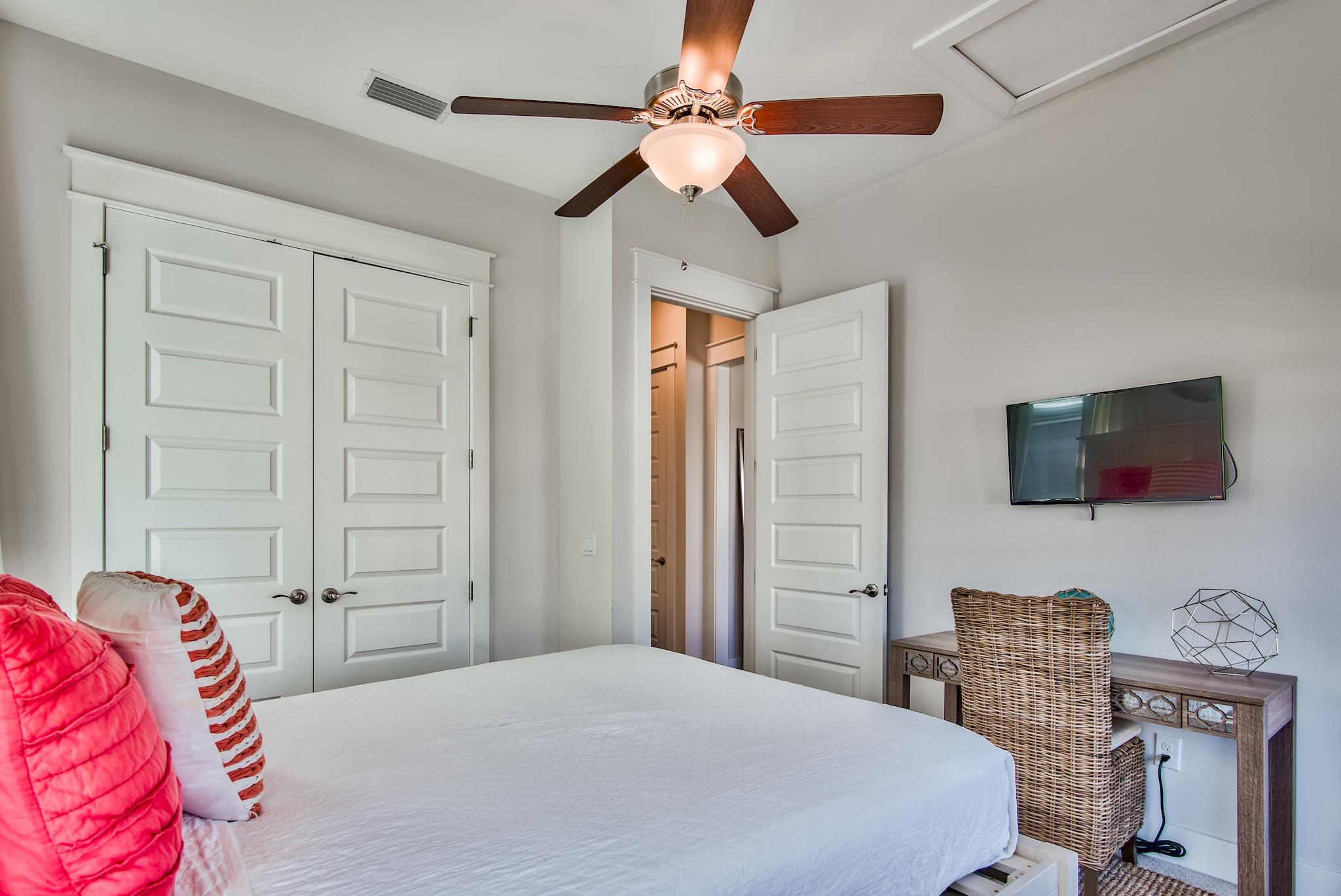 33 Milestone Dr Inlet Beach, Unit C Inlet Beach, FL 32461 - Photo 17 of 24 a bedroom with a bed and a flat screen tv