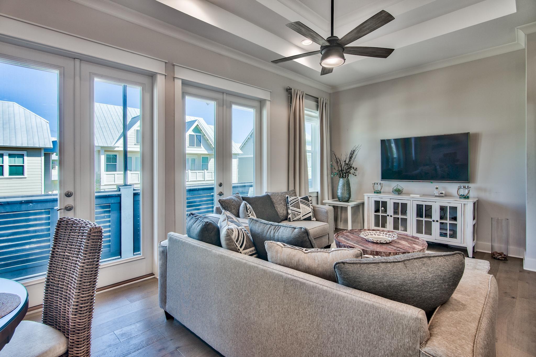 33 Milestone Dr Inlet Beach, Unit C Inlet Beach, FL 32461 - Photo 3 of 24 a living room with furniture and a flat screen tv