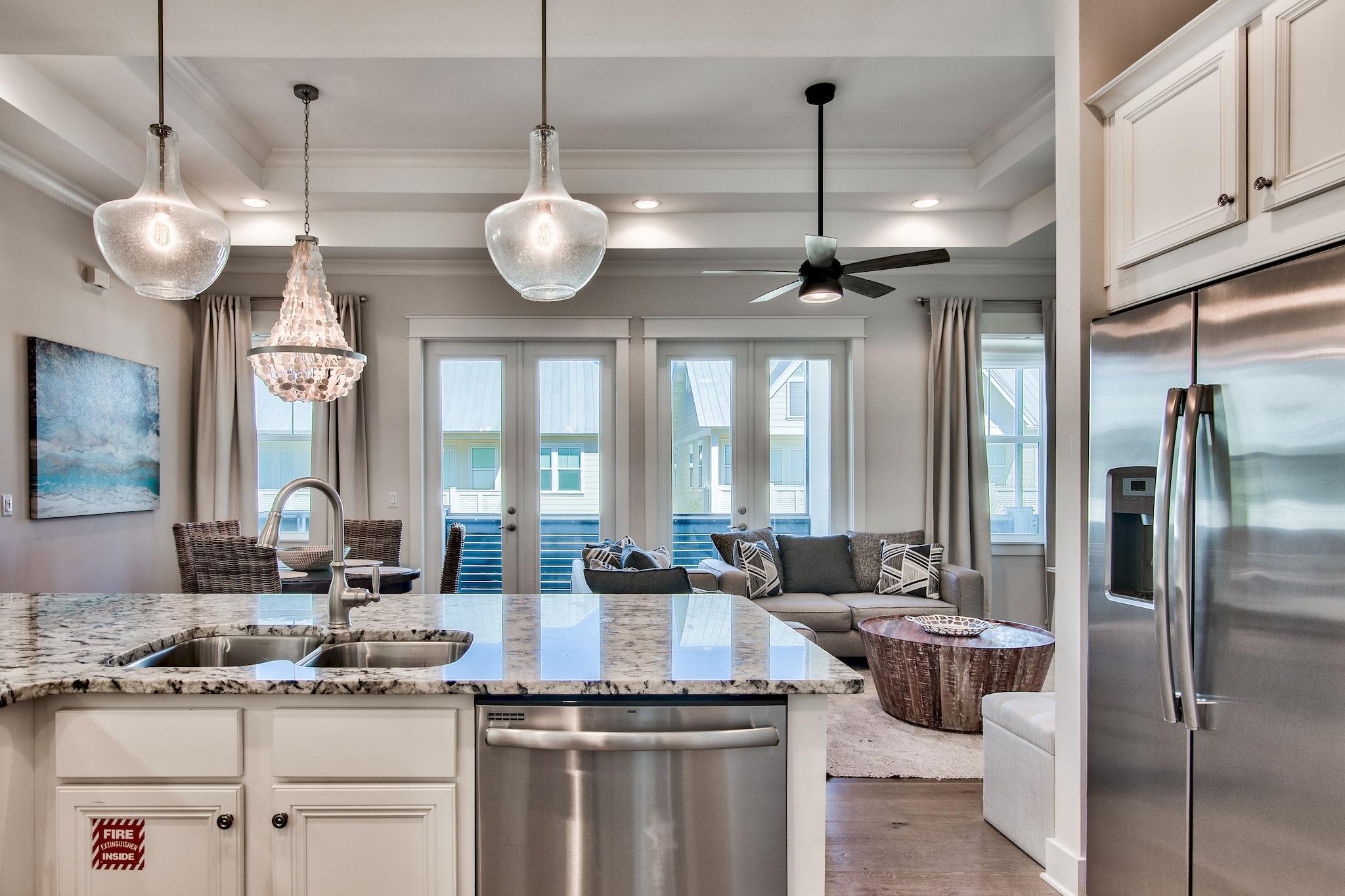 33 Milestone Dr Inlet Beach, Unit C Inlet Beach, FL 32461 - Photo 9 of 24 a large kitchen with a large window and stainless steel appliances