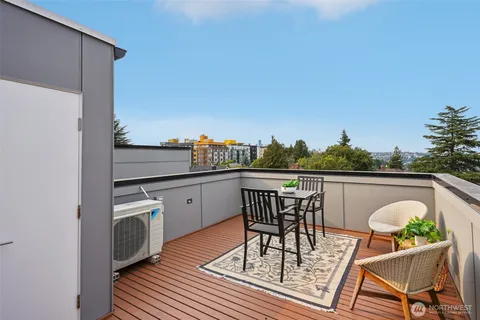 a view of a balcony with table and chairs