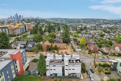 an aerial view of residential building with parking