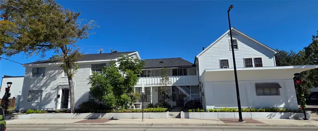 a view of a house with a street
