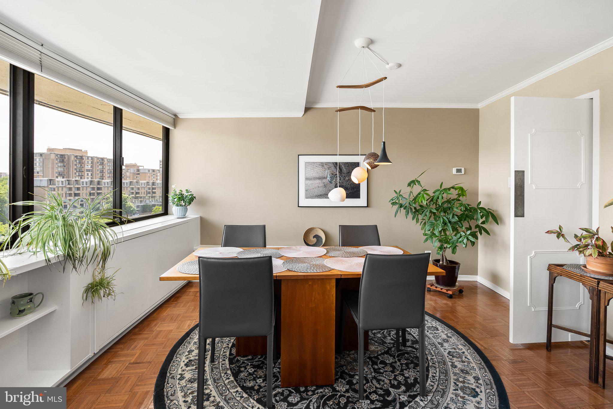 2500 Virginia Avenue Northwest, Unit 906S Washington, DC 20037 - Photo 18 of 39 a dining room with furniture window and wooden floor
