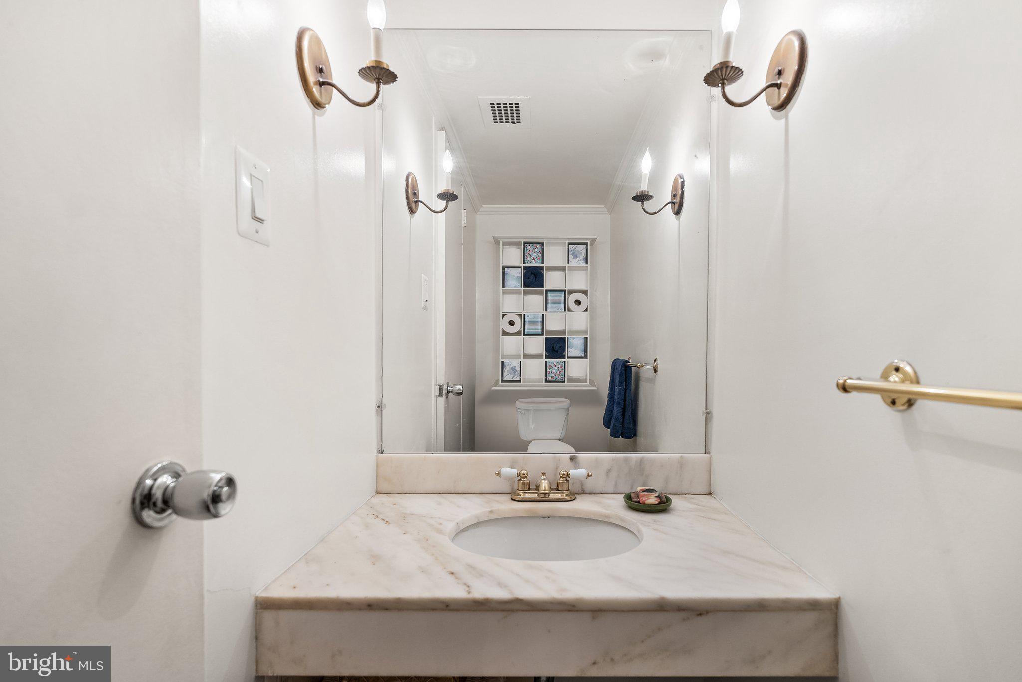 2500 Virginia Avenue Northwest, Unit 906S Washington, DC 20037 - Photo 19 of 39 a bathroom with a granite countertop sink a mirror and shower