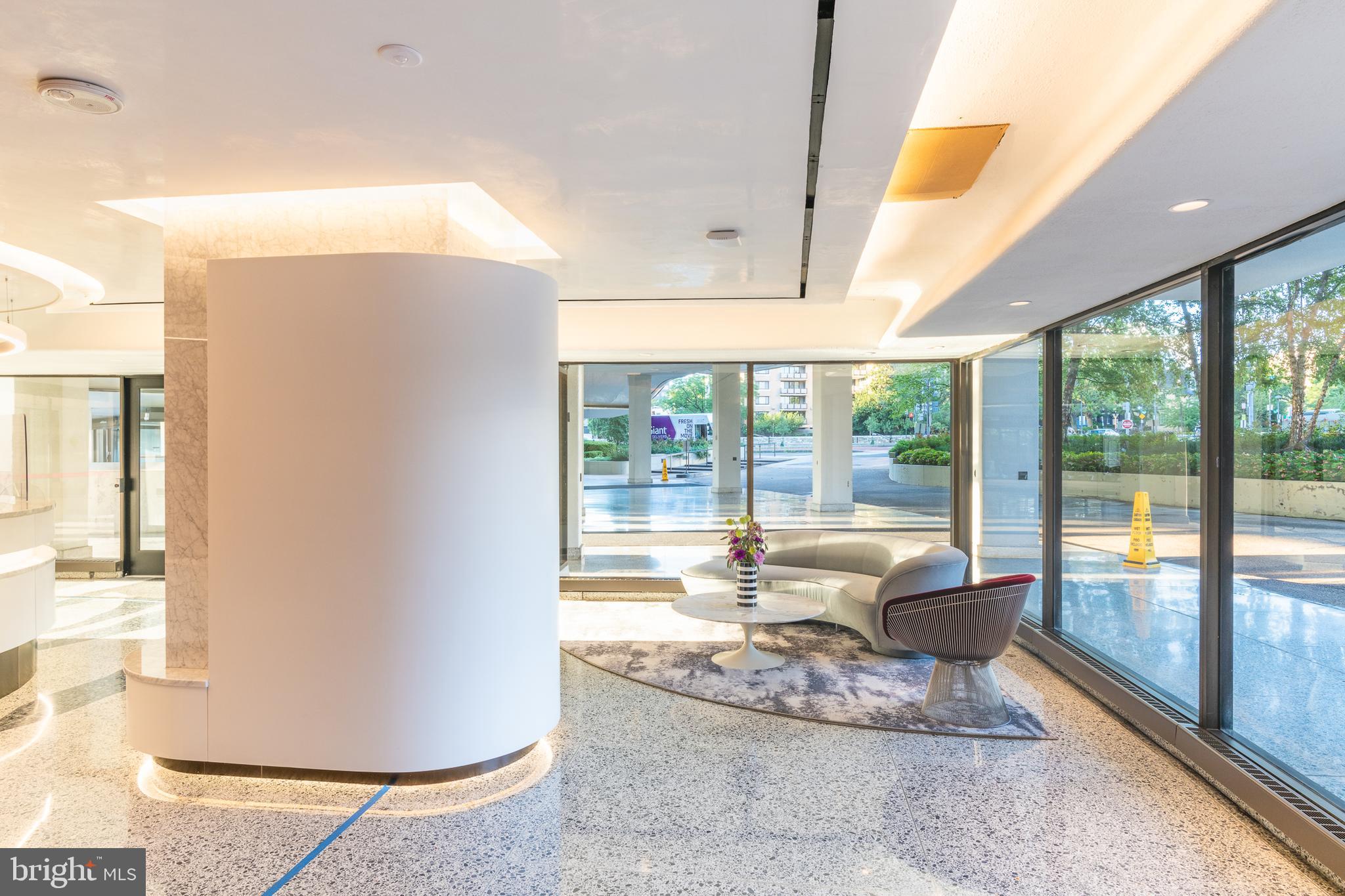 2500 Virginia Avenue Northwest, Unit 906S Washington, DC 20037 - Photo 31 of 39 a living room with large windows