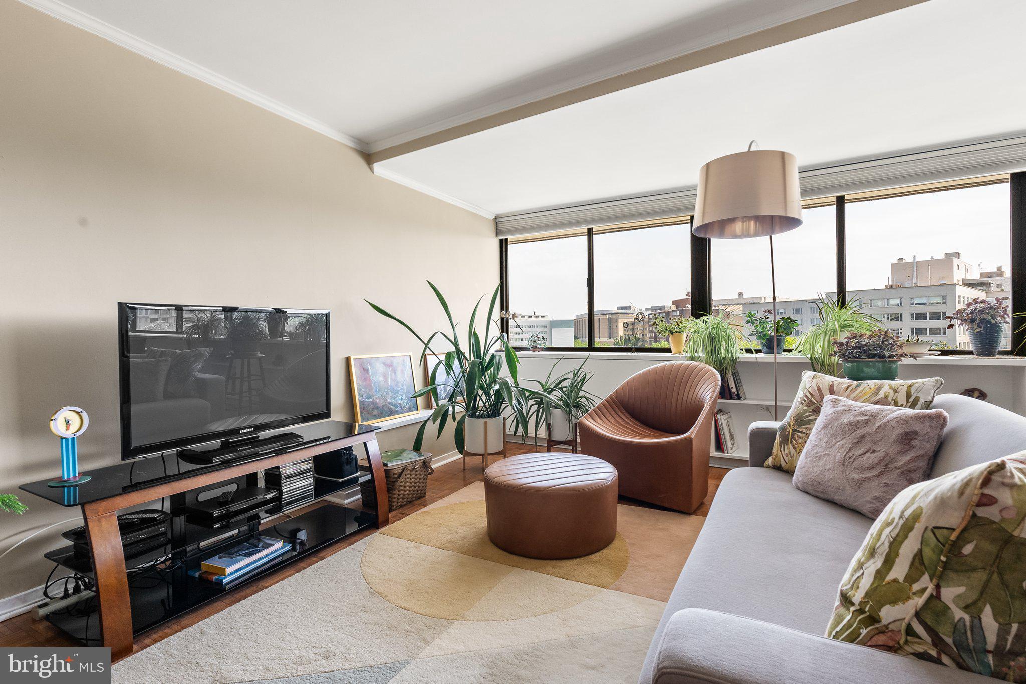 2500 Virginia Avenue Northwest, Unit 906S Washington, DC 20037 - Photo 8 of 39 a living room with furniture and a flat screen tv