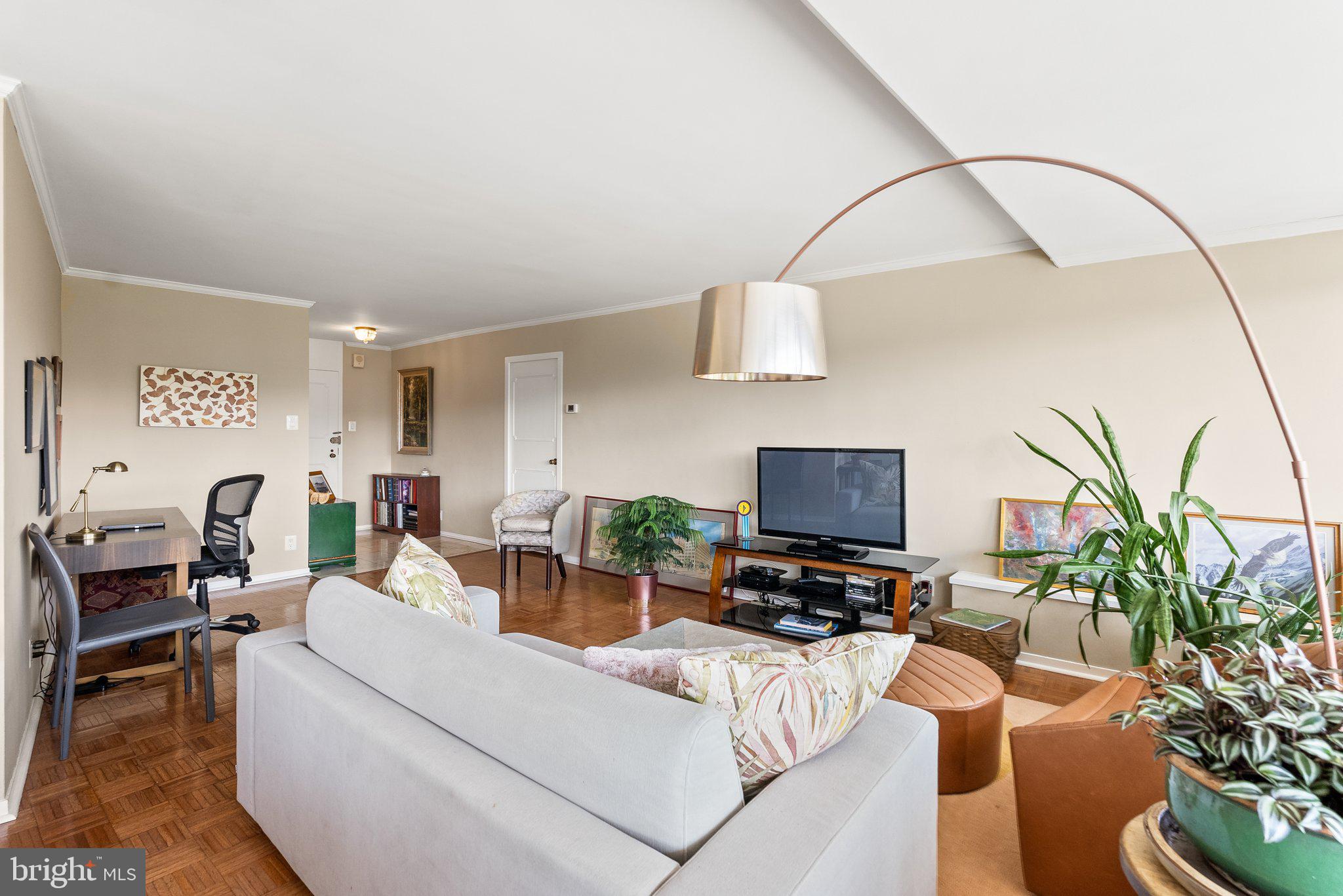 2500 Virginia Avenue Northwest, Unit 906S Washington, DC 20037 - Photo 10 of 39 a living room with furniture and a flat screen tv
