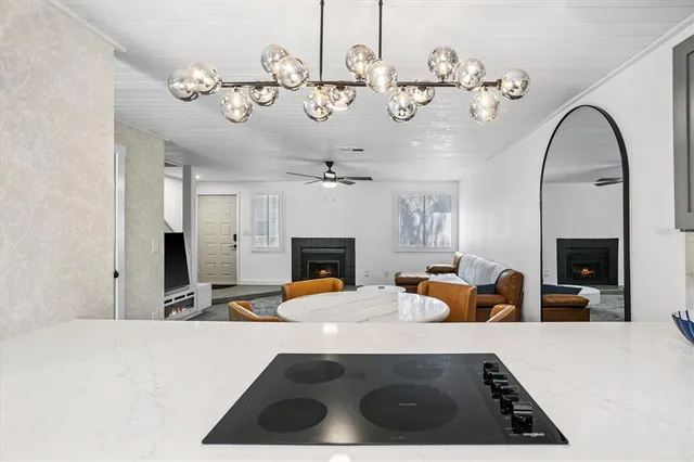 a view of a living room and chandelier