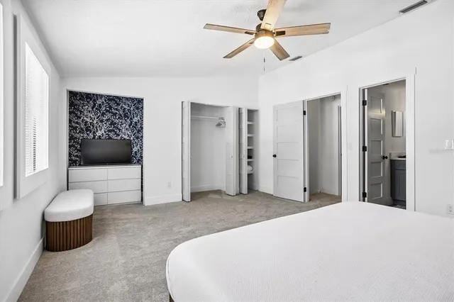 a bedroom with a bed and a chair