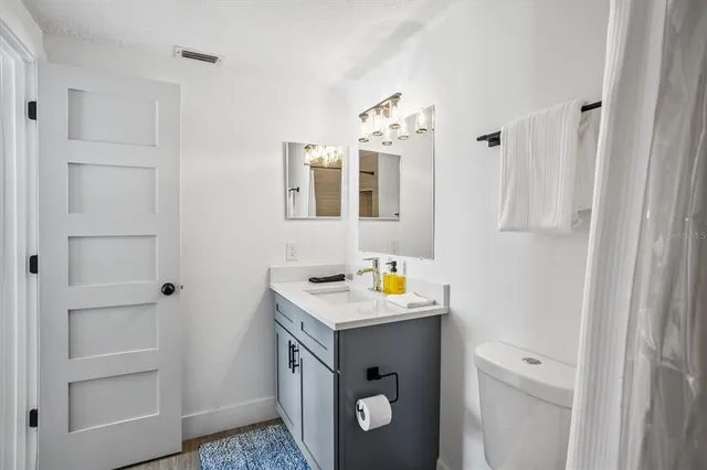 a utility room with cabinets washer and dryer