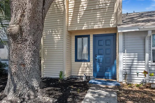 a view of a house with a door and wooden floor