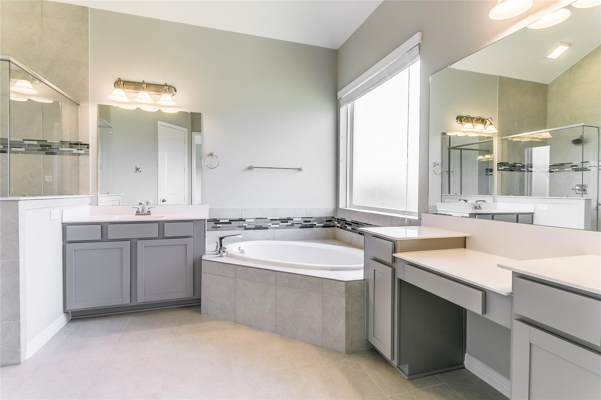 4227 Carol Ridge Drive Sugar Land, TX 77479 - Photo 18 of 35 a bathroom with a sink double vanity and a mirror
