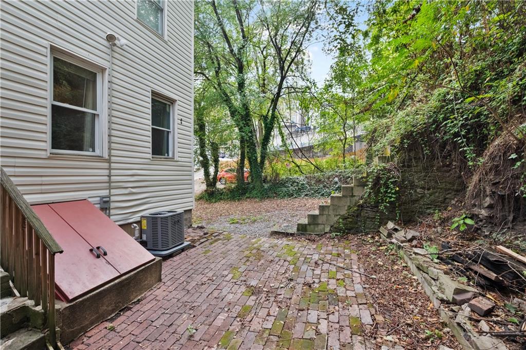 22 Eleanor Street Pittsburgh, PA 15203 - Photo 23 of 36 a view of a backyard with chairs and a fire pit