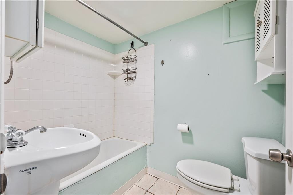 22 Eleanor Street Pittsburgh, PA 15203 - Photo 8 of 36 a bathroom with a sink a toilet and shower