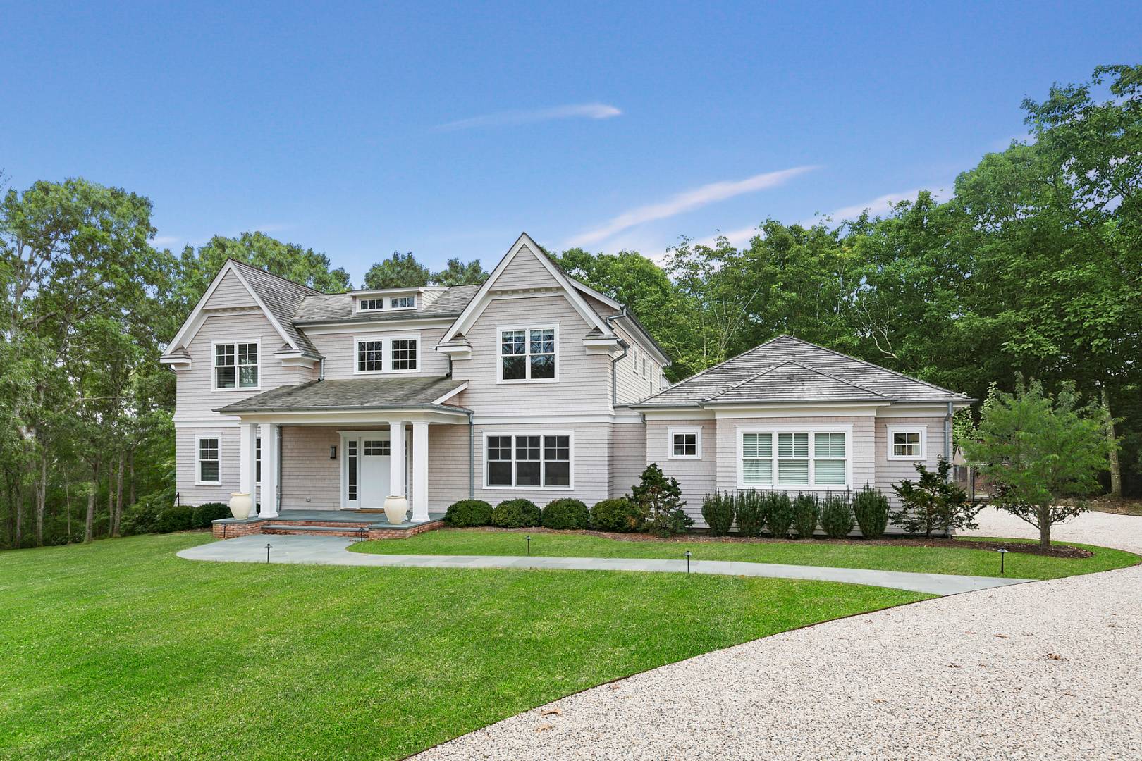 2 Frazier Avenue Southampton, NY 11968 - Photo 1 of 12 a front view of a house with a yard