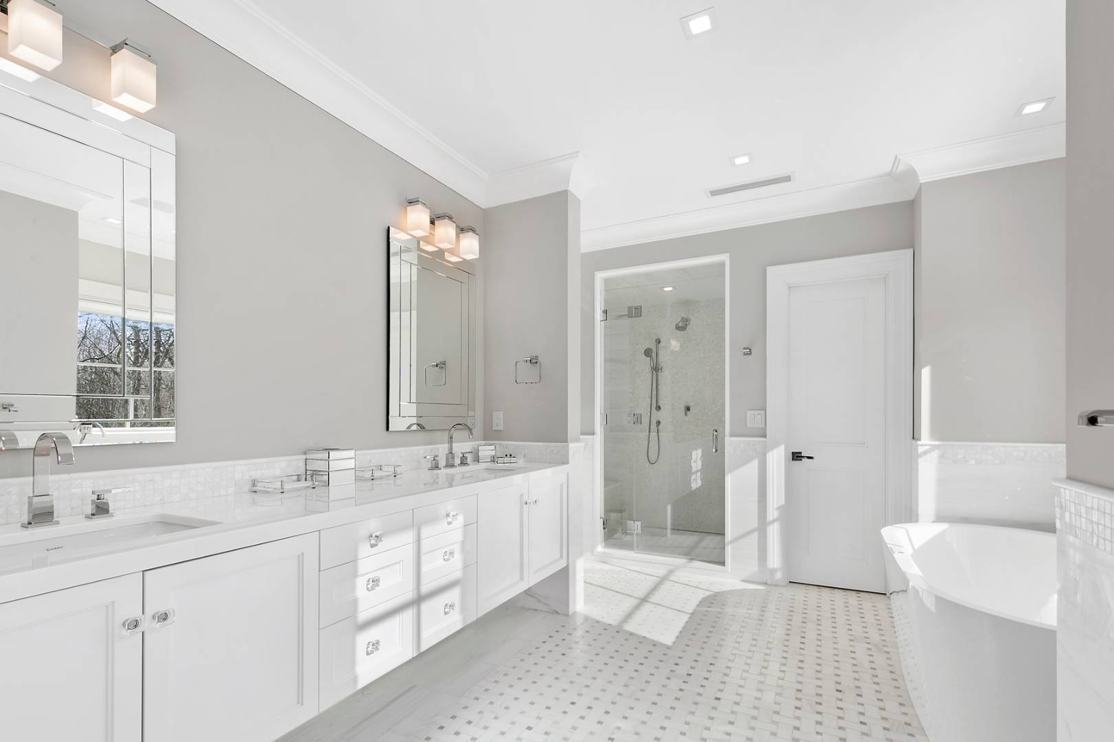 2 Frazier Avenue Southampton, NY 11968 - Photo 7 of 12 a spacious bathroom with a double vanity sink mirror double and bathtub