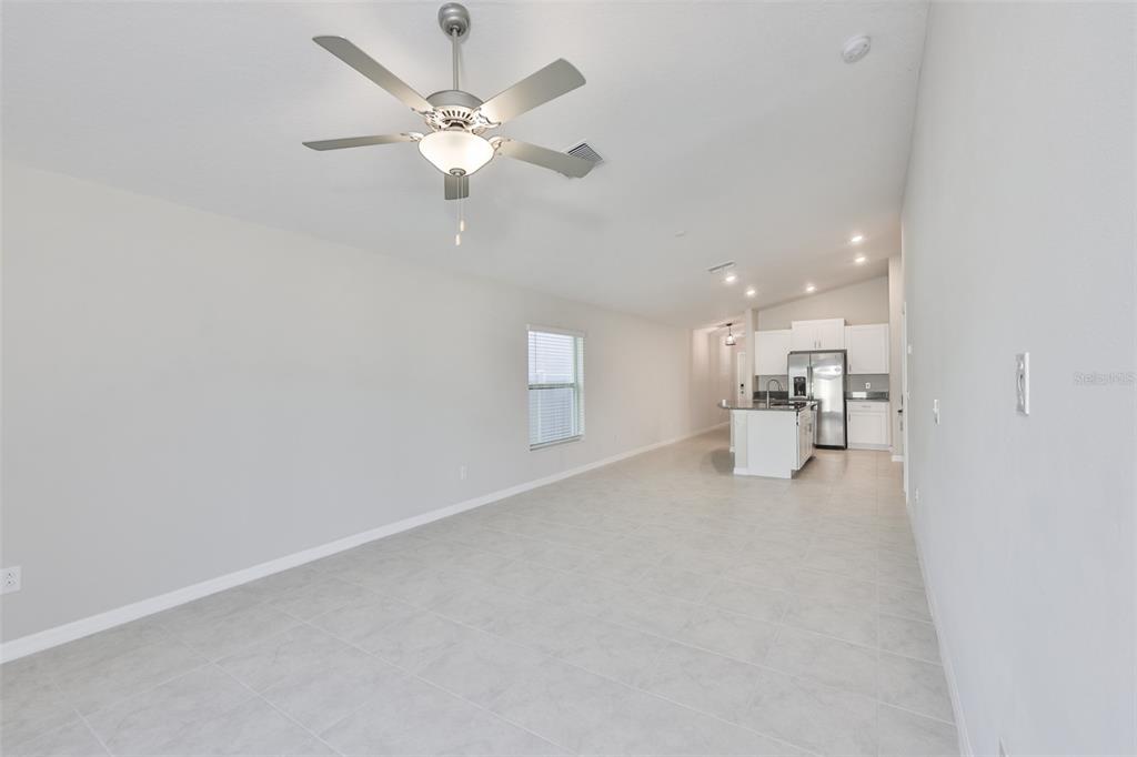 31867 Barrel Wave Way Wesley Chapel, FL 33545 - Photo 12 of 45 a view of a livingroom with a kitchen