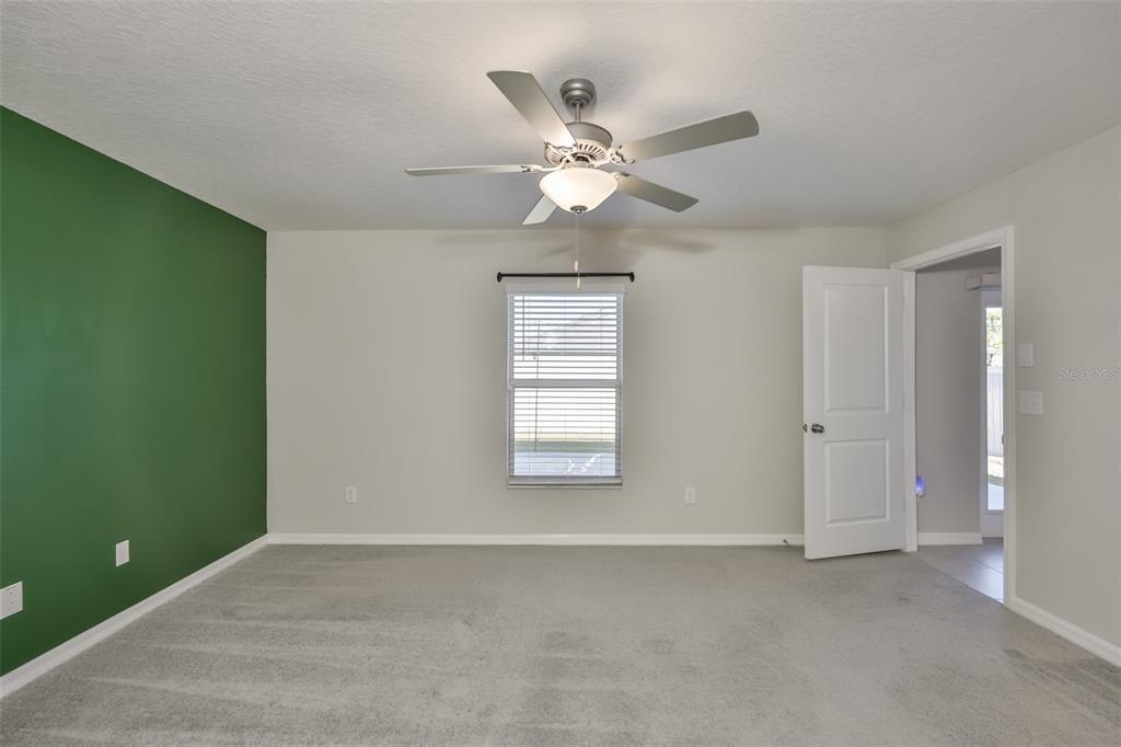 31867 Barrel Wave Way Wesley Chapel, FL 33545 - Photo 19 of 45 a view of an empty room with a window