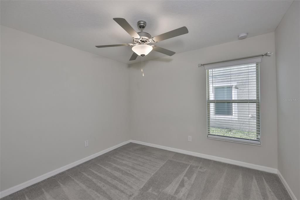 31867 Barrel Wave Way Wesley Chapel, FL 33545 - Photo 24 of 45 a view of an empty room with a window