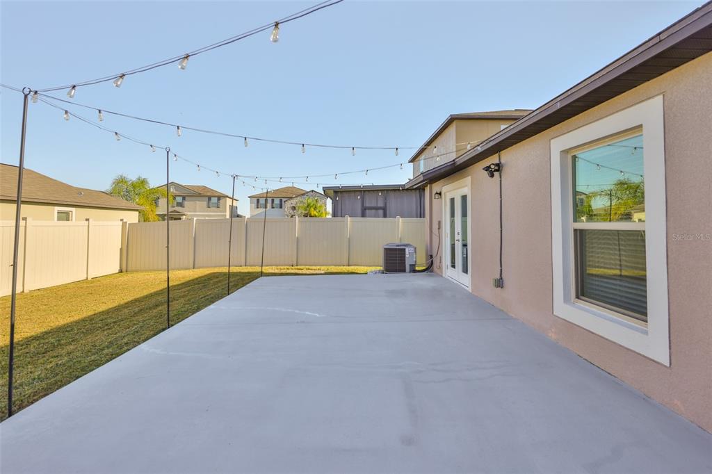 31867 Barrel Wave Way Wesley Chapel, FL 33545 - Photo 31 of 45 a view of a backyard