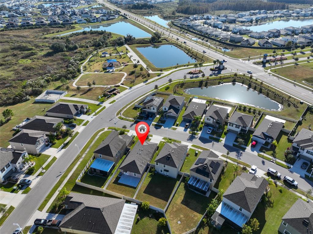 31867 Barrel Wave Way Wesley Chapel, FL 33545 - Photo 32 of 45 an aerial view of a building with outdoor space