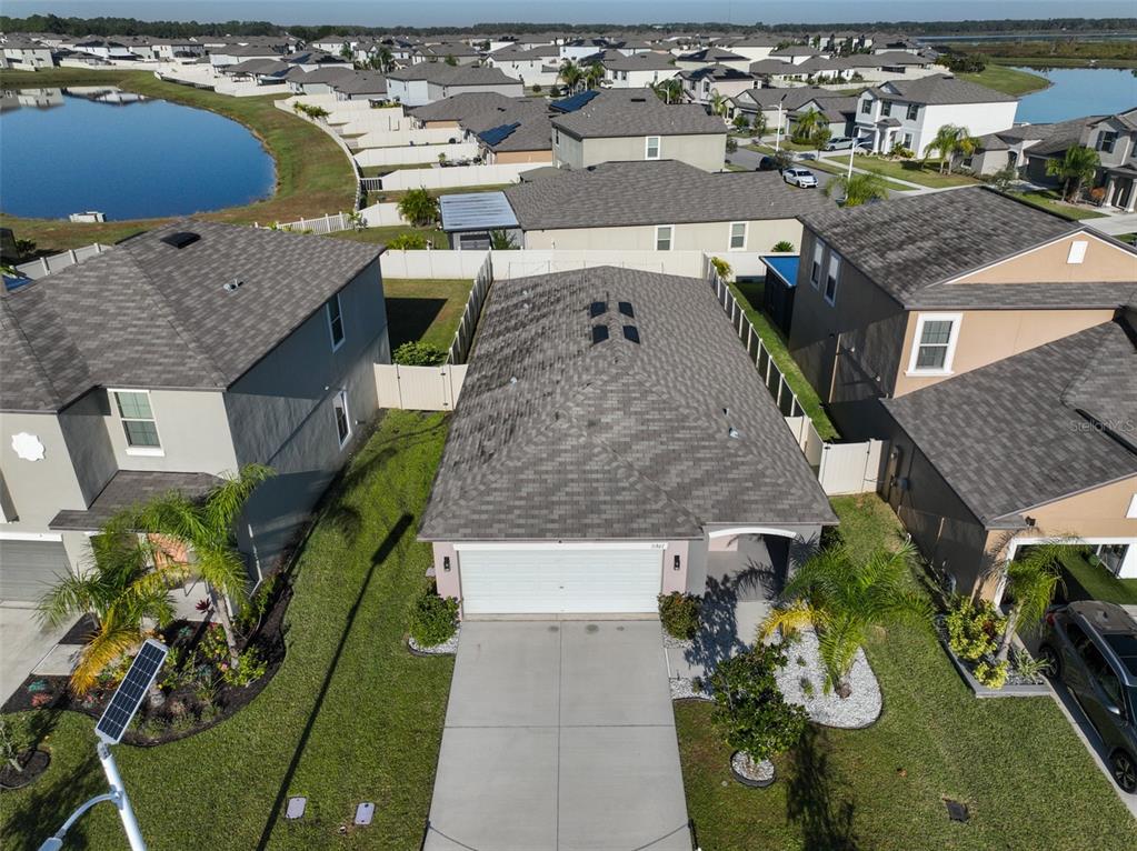 31867 Barrel Wave Way Wesley Chapel, FL 33545 - Photo 34 of 45 an aerial view of a house with garden space and houses