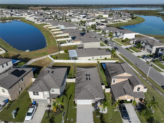 an aerial view of a house with outdoor space