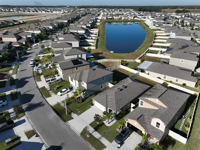 an aerial view of a house with a swimming pool