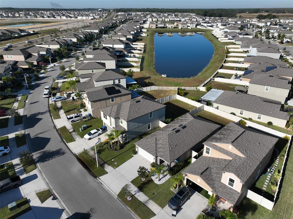 31867 Barrel Wave Way Wesley Chapel, FL 33545 - Photo 36 of 45 an aerial view of residential houses with outdoor space