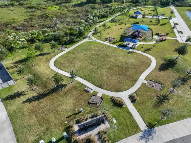 an aerial view of a house with outdoor space