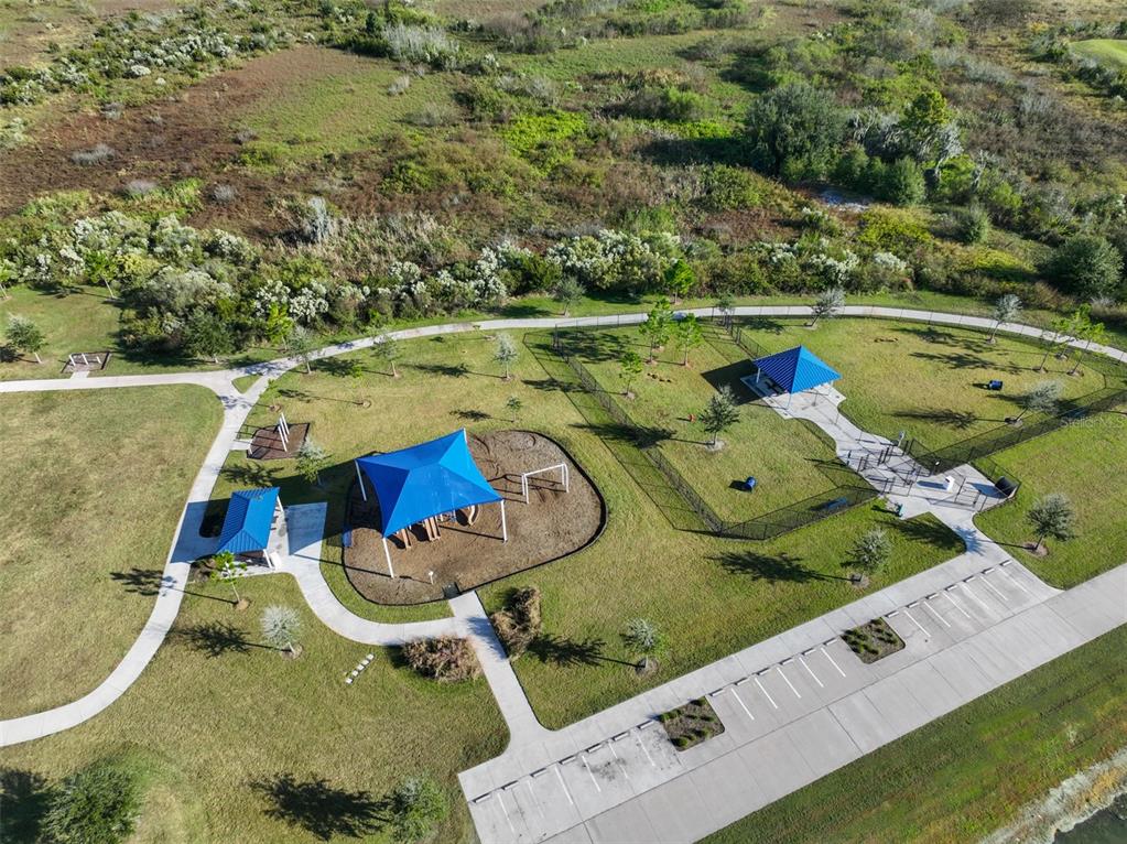 31867 Barrel Wave Way Wesley Chapel, FL 33545 - Photo 38 of 45 an aerial view of a house with a swimming pool