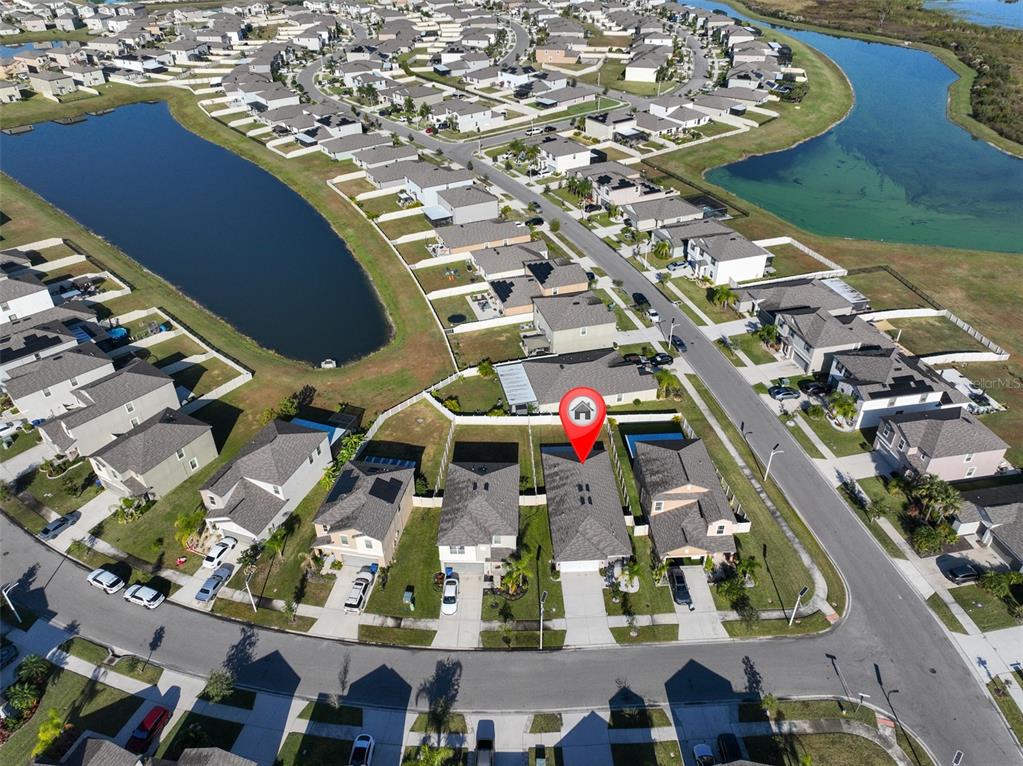 31867 Barrel Wave Way Wesley Chapel, FL 33545 - Photo 40 of 45 an aerial view of a residential houses with outdoor space