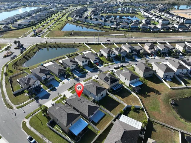an aerial view of a house with a ocean view