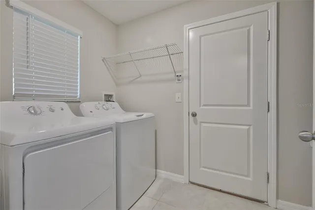 a view of a kitchen island a sink dishwasher a stove with wooden cabinets
