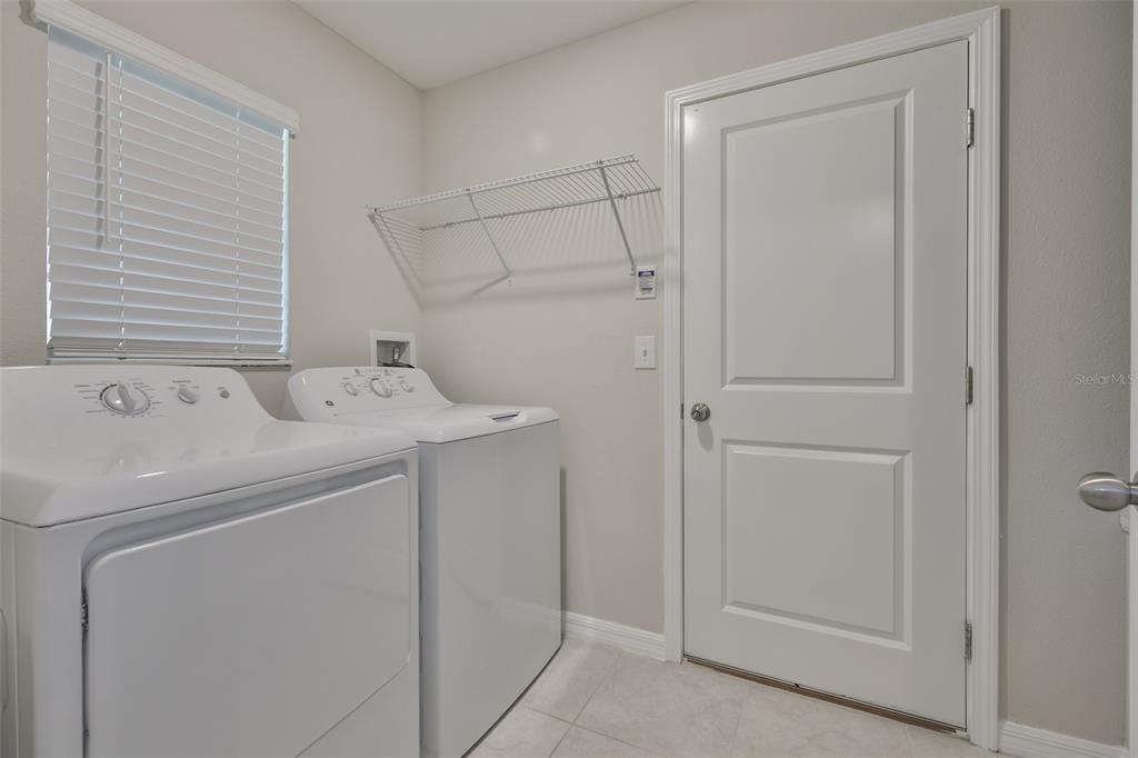 31867 Barrel Wave Way Wesley Chapel, FL 33545 - Photo 7 of 45 a utility room with dryer and washer