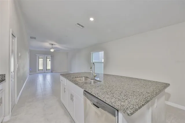 a view of a livingroom with a kitchen