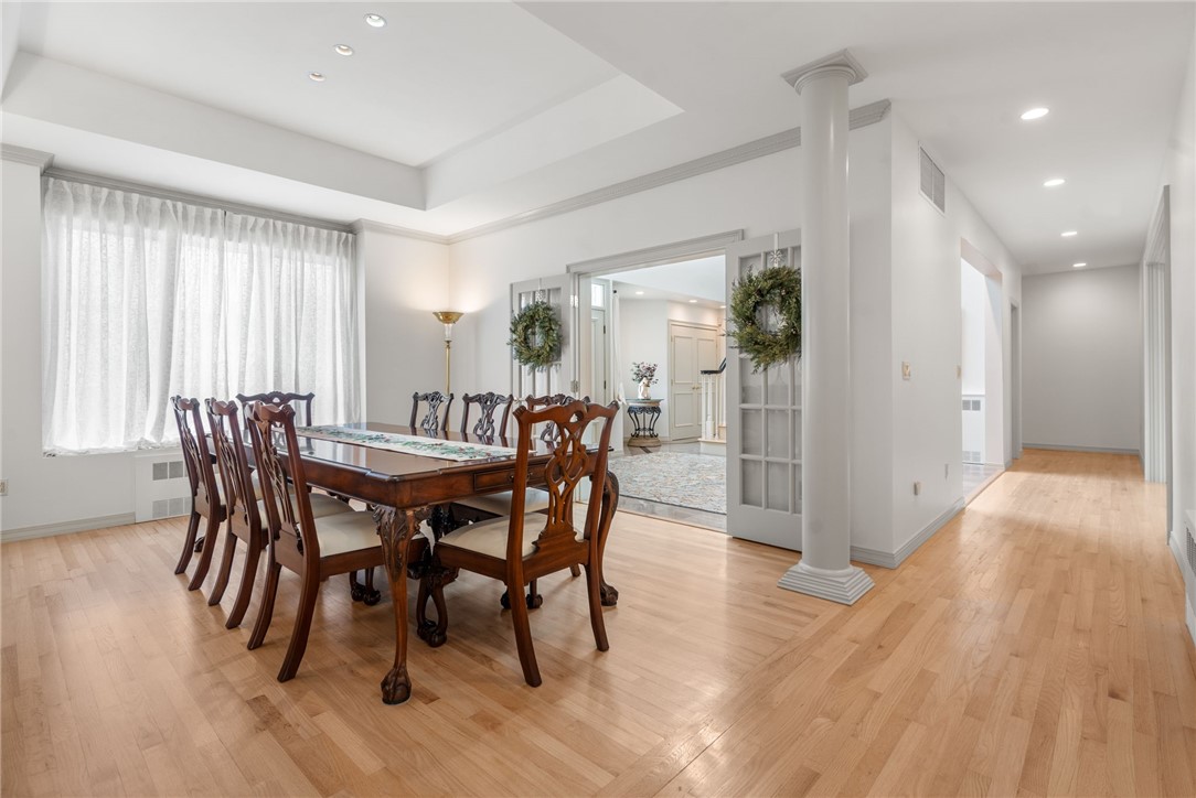 7 Oak Tree Lane Cranston, RI 02920 - Photo 3 of 32 Tray ceiling and gleaming hardwood floors surrounded by Tuscan columns and glass French Doors that open from the grand entrance