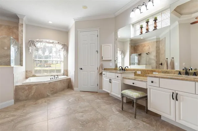 a kitchen with granite countertop a refrigerator and a sink