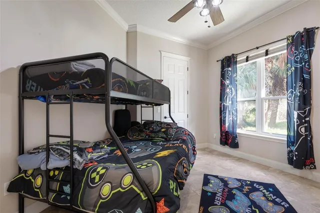 a dining room with furniture and a floor to ceiling window