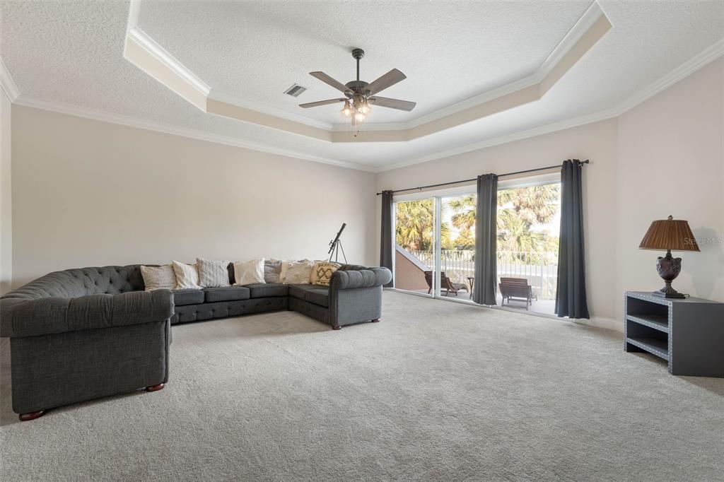 67 Island Estates Parkway Palm Coast, FL 32137 - Photo 31 of 84 a living room with furniture and a large window