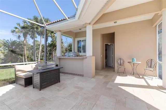 a view of a backyard with chairs