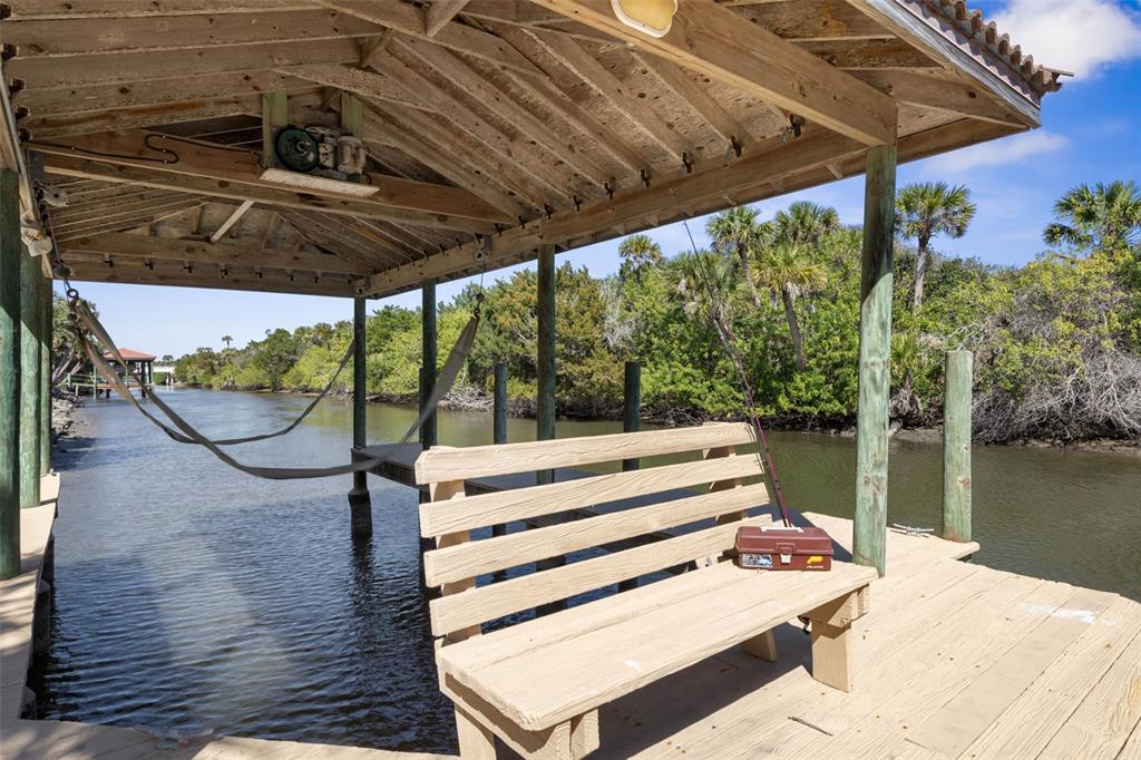67 Island Estates Parkway Palm Coast, FL 32137 - Photo 60 of 84 a view of a balcony with chairs and wooden floor